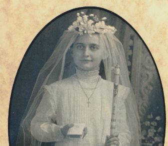 Photo of Annella in a white dress.